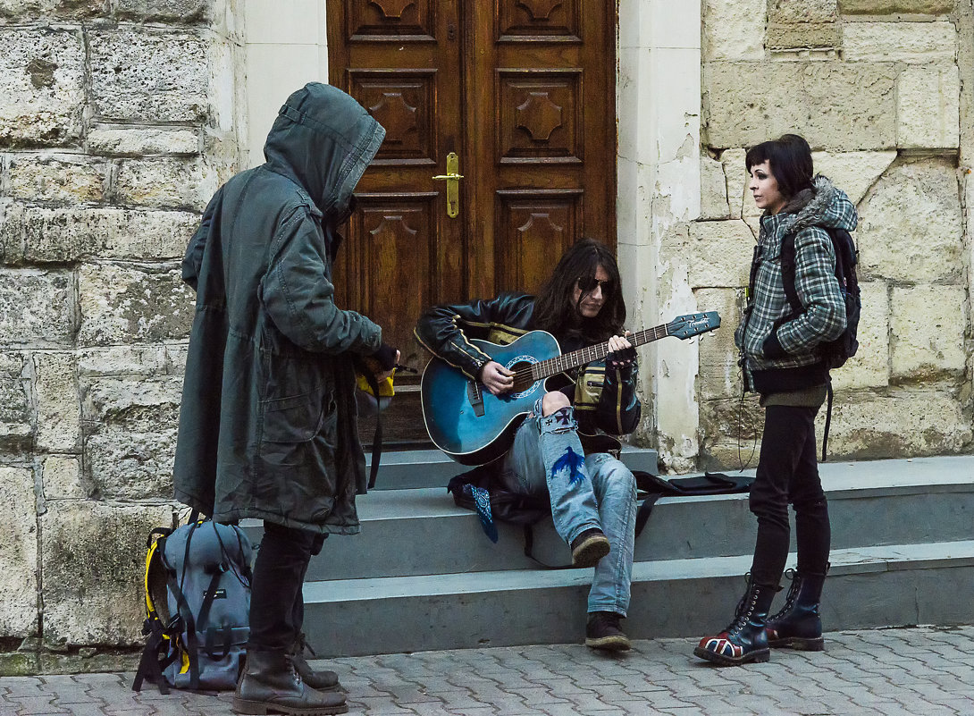 Man with his friends playing guitar - Сергей 