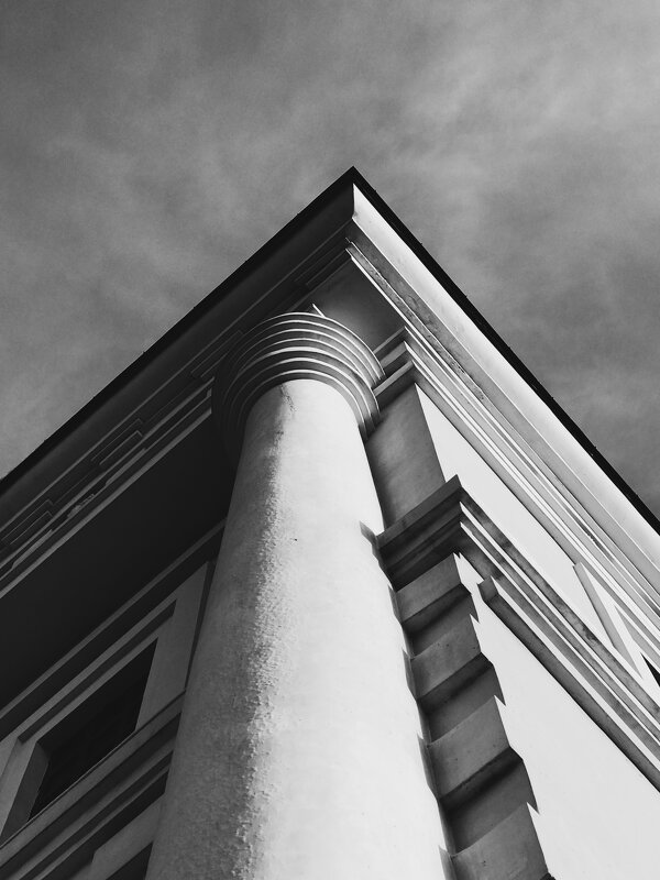Corner of a building column against the sky - Roman Griev